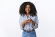© Cookie Studio - Pleasant gorgeous friendly-looking african american girlfriend wearing modern stylish blouse holding smartphone smiling broadly nice outgoing attitude, edit selfie using internet app