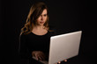© burdun - Nervous and upset young woman with laptop getting problems. Bad news on the screen