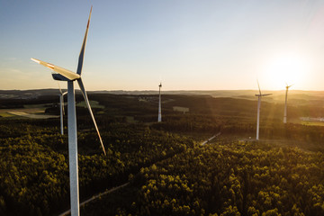  Wind Turbine in the sunset seen from an aerial view