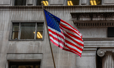 Fototapete - American flag in Chicago, Illinois downtown. Classic building facade background.