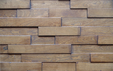 Close up sectional view of a decorative wall panel made of bricks of wood