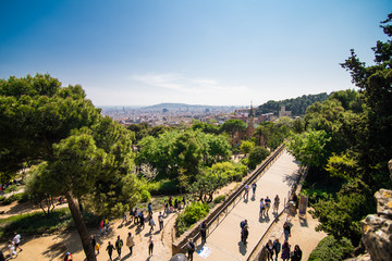 BARCELONA, SPAIN - April, 2019: Park Guell entrance buildings. The Park Guell is a public park system composed of gardens and architectonic elements. The park was designed by Antoni Gaudi.