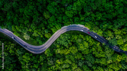 Forest Road view from above, Aerial view asphalt road in tropical tree forest with a road going through with car, Adventure in Asia background concept Tableau sur Toile