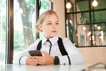 Charismatic girl as a businesswoman in cafe at lunch. Business youth.