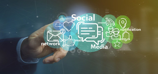 Businessman holding a cloud of social media network icon