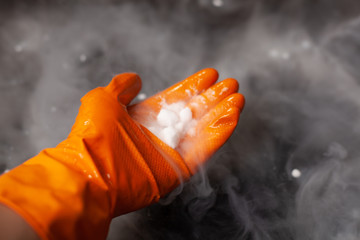 Thick white smoke on a background of black ceramic tiles.