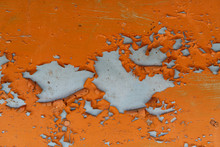 Orange Paint Peeling Off Old Metal Strips. Old Metallic Patchwork Orange. Metal Panels Are Peeling Off Paint. Old Metal Sheets