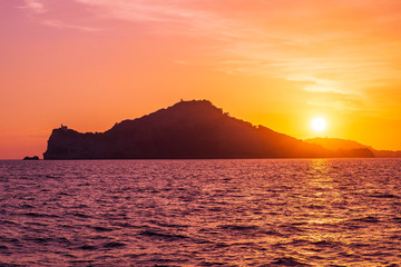 Poster - Ischia island in Italy view from the sea at sunset