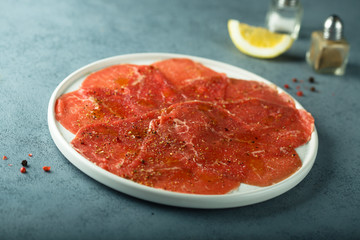 Poster - Homemade beef carpaccio with salt and pepper