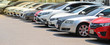 © Amphon - Closeup of front side of  cars parking in outdoor parking lot beside the street beside the street in bright sunny day.