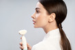 © Yakobchuk Olena - Gorgeous young woman holding pore cleansing brush