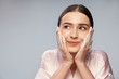 © Yakobchuk Olena - Charming young woman washing face with foaming cleanser