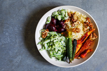 Wall Mural - Buddha bowl with roast beetroots, carrots, zucchini and green peas salad