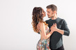 © satura_ - Salsa, kizomba and bachata dancers on white background with copy space. Social dance concept