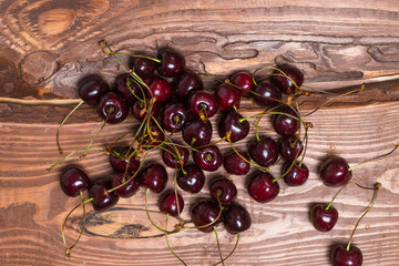 Poster - Fresh sweet sweet cherry on a wooden background.