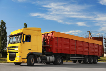 Modern bright truck parked on country road