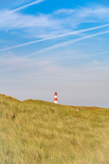 Lighthouse red white on dune. Sylt island – North Germany.  