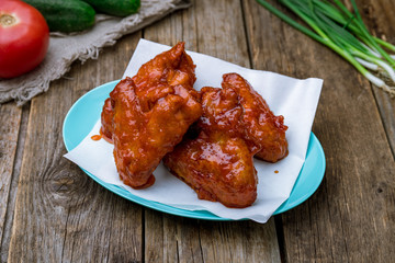 Wall Mural - chicken wings in barbecue sauce