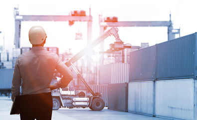 Double exposure of man with world map for logistic network distribution on background and Logistics Industrial Container Cargo freight ship for shipping and Transportation, import-export