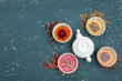 © fotofabrika - Tea concept. Different kinds of dry tea in ceramic bowls and cups of aromatic tea
