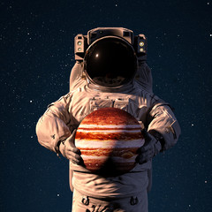 Wall Mural - astronaut holding planet jupiter, world of the solar system