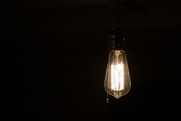 Lamps with tungsten filament. Edison's light bulb. Filament filament in vintage lamps. Retro design of light bulbs.