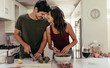 © Jacob Lund - Loving couple cutting vegetables together in kitchen
