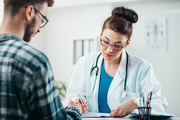 Wall Mural - Woman Doctor prescribes medicine to Young Patient