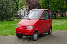Amsterdam, Netherlands - May 03 2019: Small Red Car For Two Persons. Canta LX.