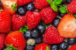 Fresh summer berries such as blueberries, strawberries, raspberries, top view