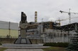 General view of the Chernobyl Nuclear Power Plant after Chernobyl disaster without metal hangar shelter on the emergency fourth power unit of the Chernobyl nuclear power plant and a memorial to the