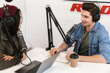 Wall Mural - Two radio hosts moderating a live show