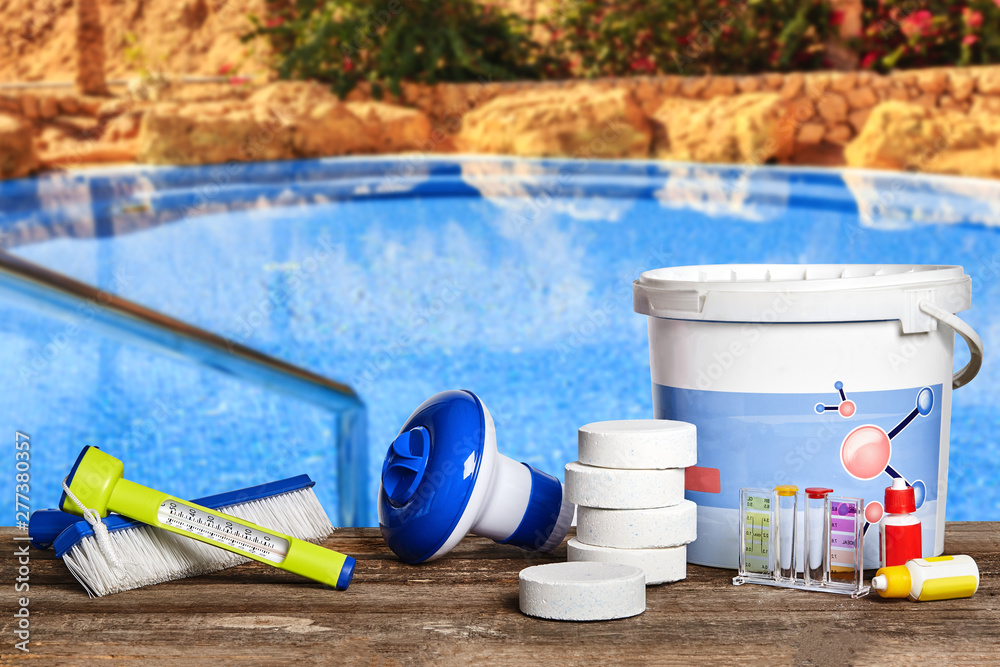 Equipment with chemical cleaning products and tools for the maintenance of the swimming pool. - obrazy, fototapety, plakaty 