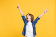 © ViDi Studio - Fun cheerful happy little kid boy in blue shirt white t-shirt posing gesturing hands isolated on yellow wall background children studio portrait. People childhood lifestyle concept. Mock up copy space