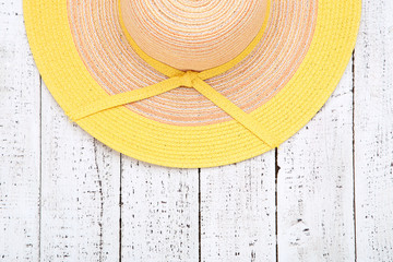 Poster - Beach hat on white wooden table