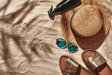 Traveler Vacation Accessories Are Laid Out On A White Beach Sand. Flat Lay, Top View.