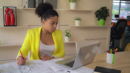 Aufkleber - mixed race woman at work wearing in casual yellow jacket.