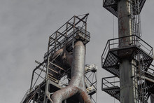 View From Below Of Blast Furnace And Smokestack In An Old Steel Mill Complex, Horizontal Aspect