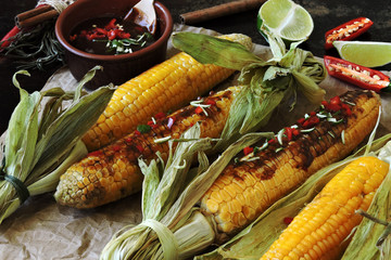 Wall Mural - Corn cobs with spicy sauce. Baked Corn