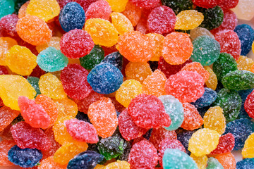 background of colorful candy sprinkled with sugar