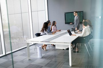 Wall Mural - Business colleagues in conference meeting room during presentation