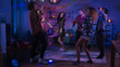 © Gorodenkoff - At the College House Party: Diverse Group of Friends Have Fun, Dancing and Socializing. Boys and Girls Dance in the Circle. Disco Neon Strobe Lights Illuminating Room.