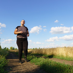 Wall Mural - Overweight runner go jogging outdoors. Weight loss, sports, healthy lifestyle