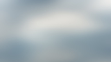 gray abstract blurred dark gradient background with light blue spots.