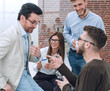 © ASDF - young business people are talking and smiling during the coffee break in office