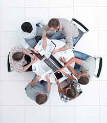 Wall Mural - top view.the business team holds a round table