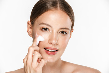 Canvas Print - Image of adorable half-naked woman washing her face with foaming facial cleanser