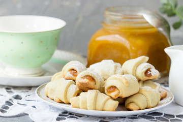 Homemade croissants with orange marmalade.