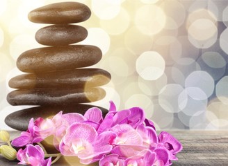 Poster - Zen basalt stones and flowers on white background