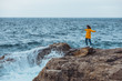 © phpetrunina14 - woman enjoying storm weather at sea
